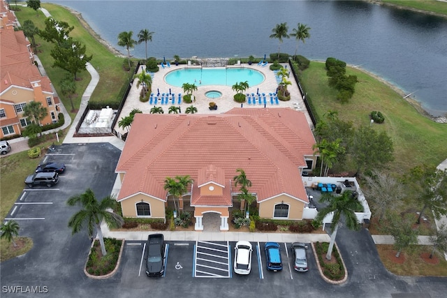 birds eye view of property with a water view