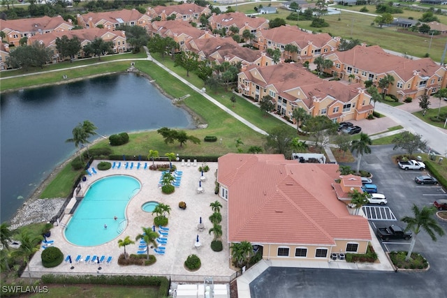 aerial view featuring a water view and a residential view