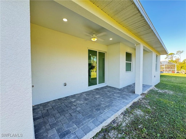 view of patio featuring a ceiling fan