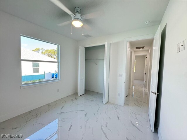 unfurnished bedroom featuring visible vents, marble finish floor, and baseboards