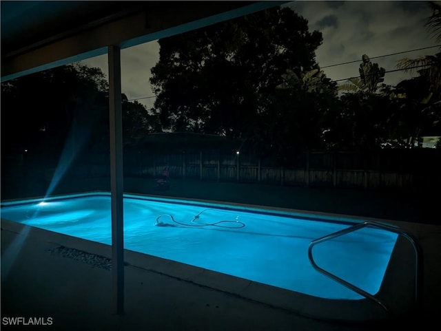 view of pool with a fenced in pool and fence