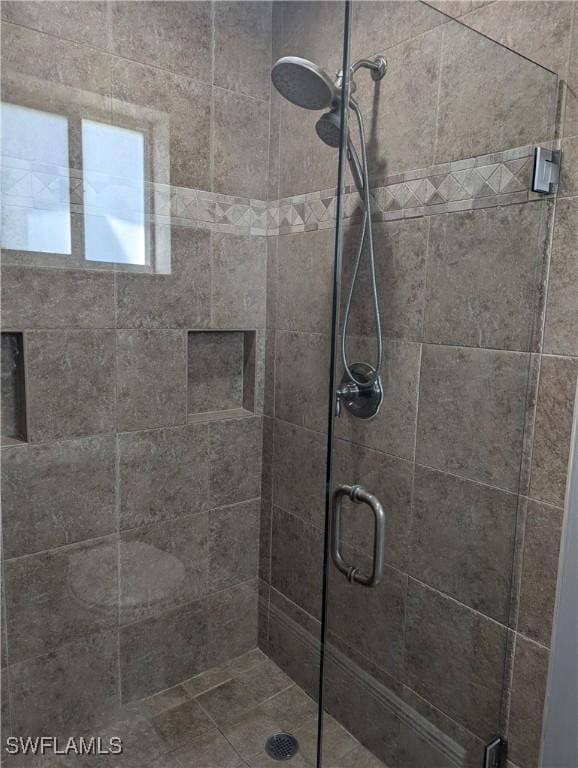 bathroom featuring a shower stall