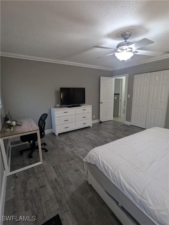 bedroom featuring crown molding, wood finished floors, baseboards, and a textured ceiling