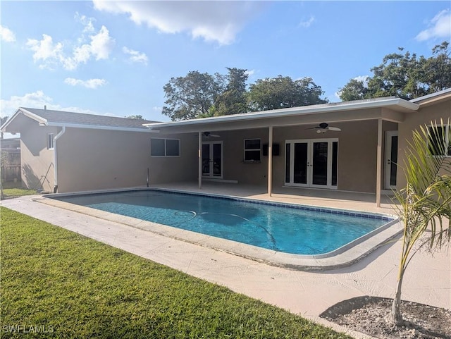 outdoor pool featuring a ceiling fan, a patio area, and french doors