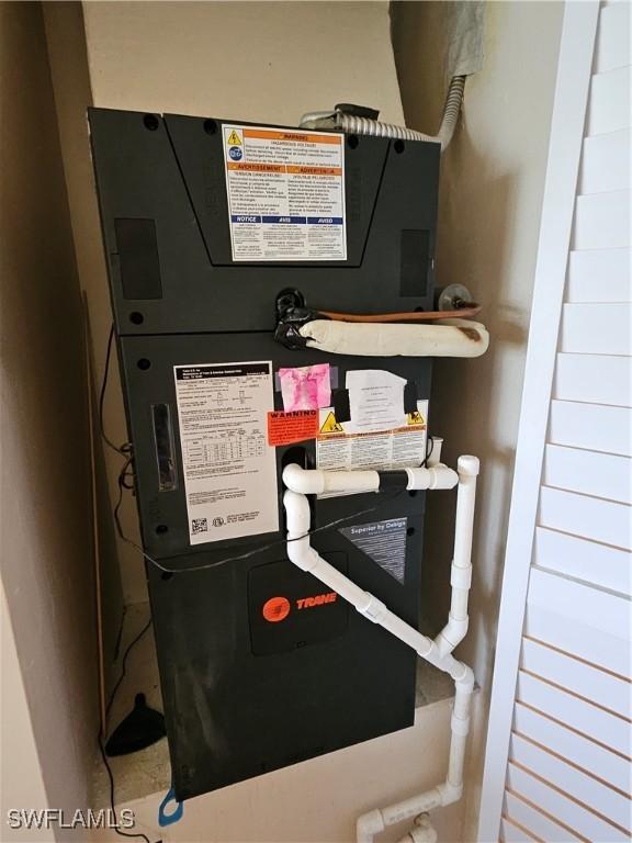 utility room with heating unit