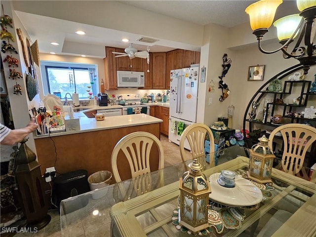 dining space featuring visible vents, recessed lighting, and ceiling fan with notable chandelier