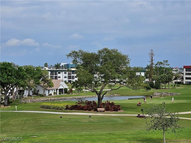 view of community featuring a yard and a water view