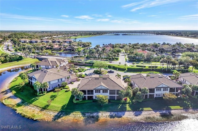 birds eye view of property with a water view and a residential view