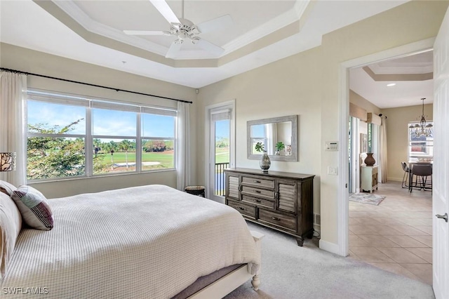 bedroom with light tile patterned floors, light carpet, a raised ceiling, and ornamental molding