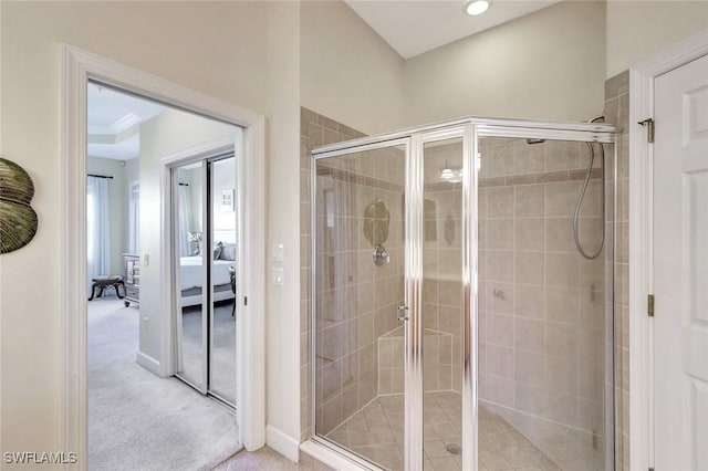 ensuite bathroom featuring recessed lighting, a shower stall, and ensuite bathroom