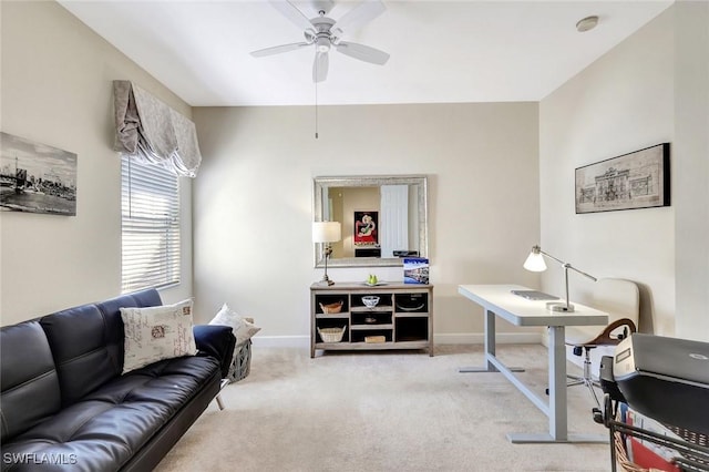 office featuring baseboards, carpet, and a ceiling fan