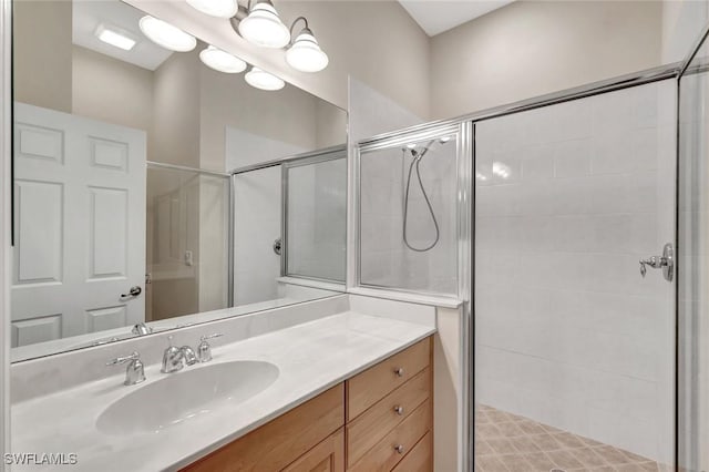 bathroom featuring vanity and a stall shower