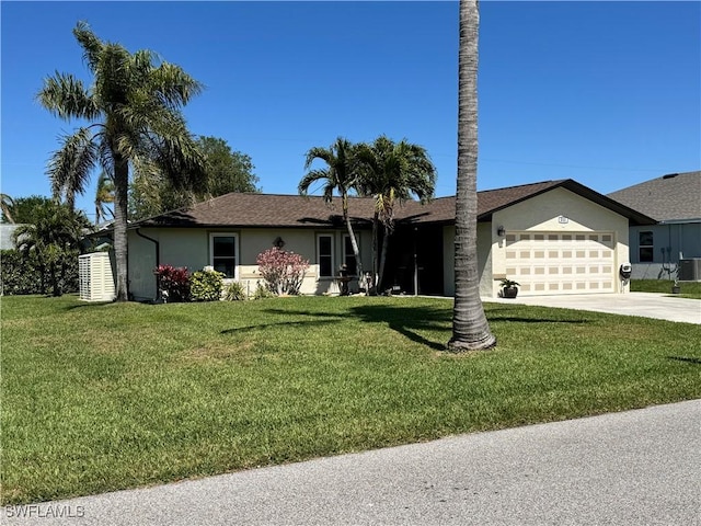 single story home with cooling unit, driveway, stucco siding, a front lawn, and a garage