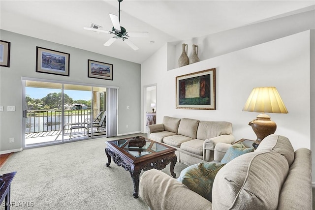 carpeted living area with visible vents, ceiling fan, high vaulted ceiling, and baseboards