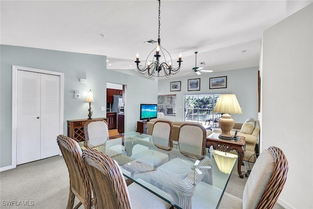 dining space with visible vents, baseboards, carpet flooring, and ceiling fan with notable chandelier