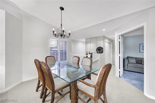 dining room with light carpet, a notable chandelier, recessed lighting, and baseboards