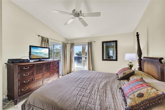 bedroom with lofted ceiling, a ceiling fan, and carpet floors