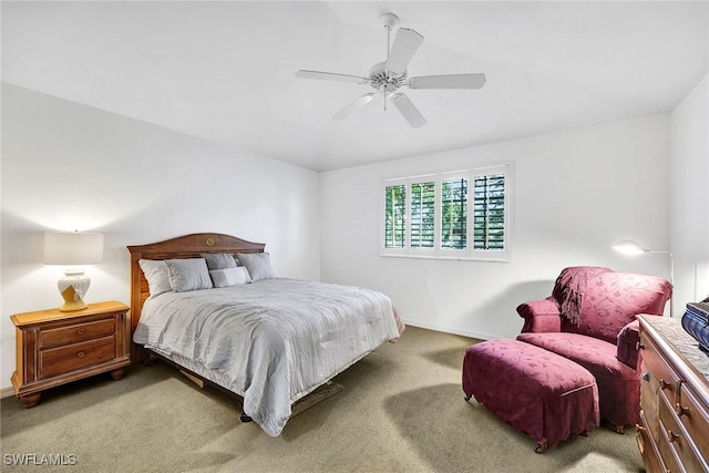 bedroom with carpet flooring, a ceiling fan, and baseboards