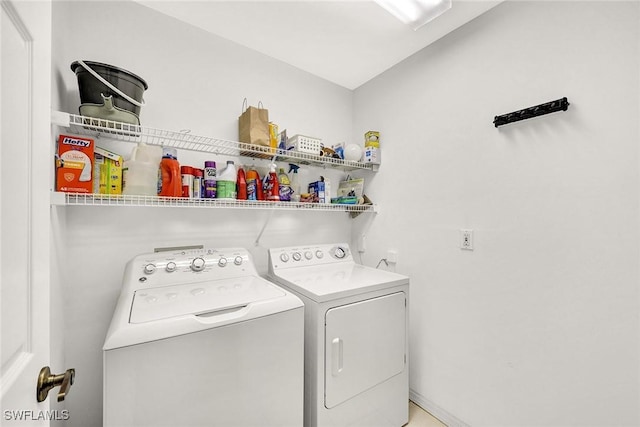 laundry room with independent washer and dryer and laundry area