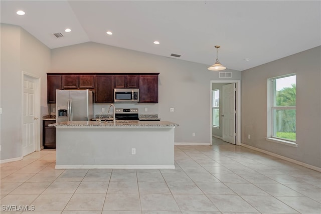 kitchen featuring visible vents, stainless steel appliances, and an island with sink