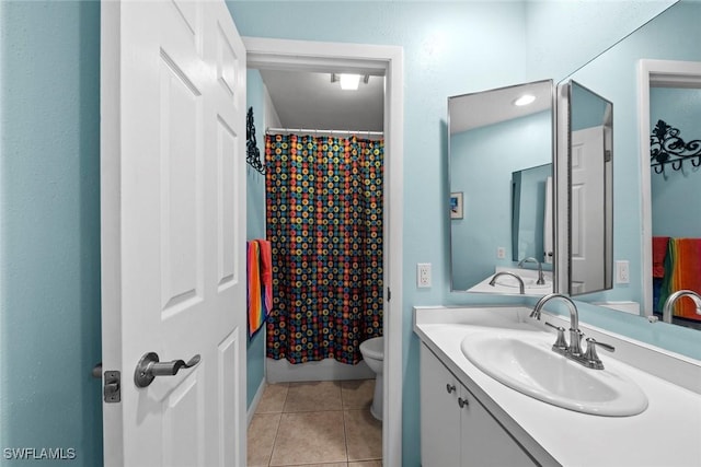 bathroom featuring tile patterned floors, toilet, a shower with shower curtain, and vanity