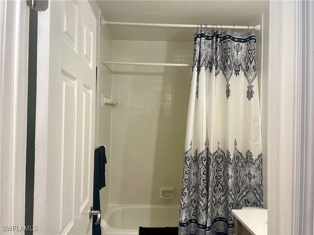 full bath featuring vanity and shower / tub combo with curtain