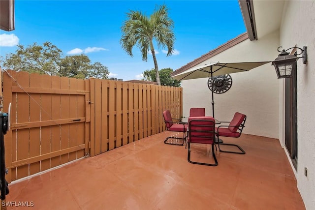 view of patio with fence