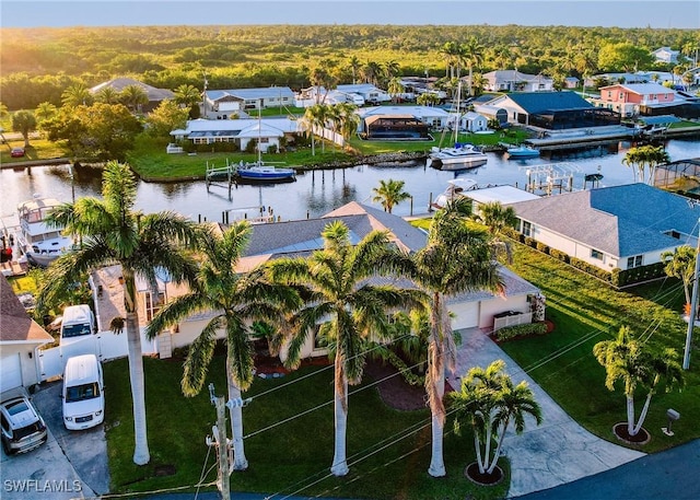 birds eye view of property featuring a residential view and a water view