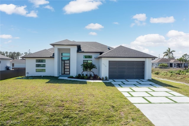 view of front facade featuring fence, concrete driveway, a front yard, roof with shingles, and a garage