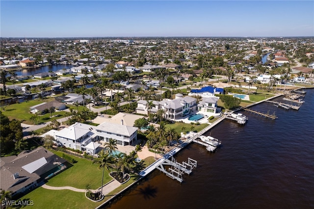 drone / aerial view featuring a water view and a residential view