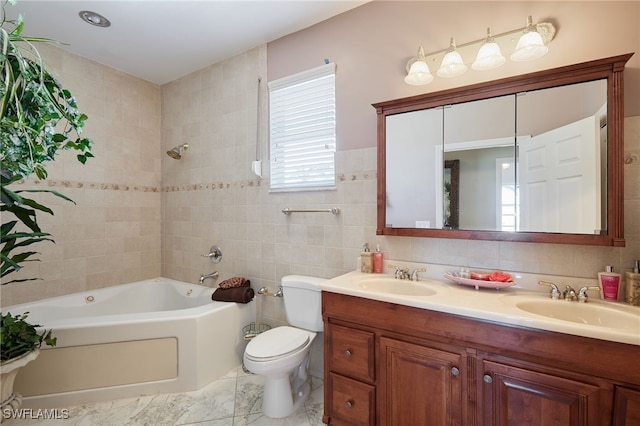 full bathroom featuring tile walls, shower / tub combination, double vanity, and a sink