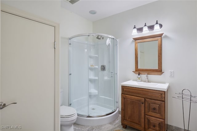 full bath featuring vanity, toilet, and a shower stall