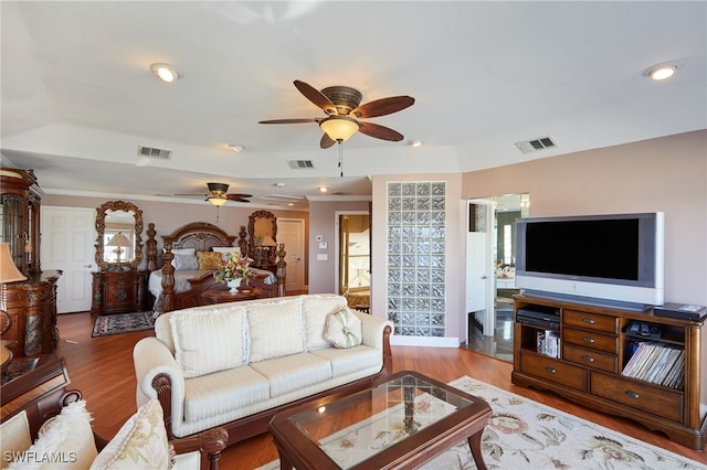 living area featuring visible vents, recessed lighting, and wood finished floors