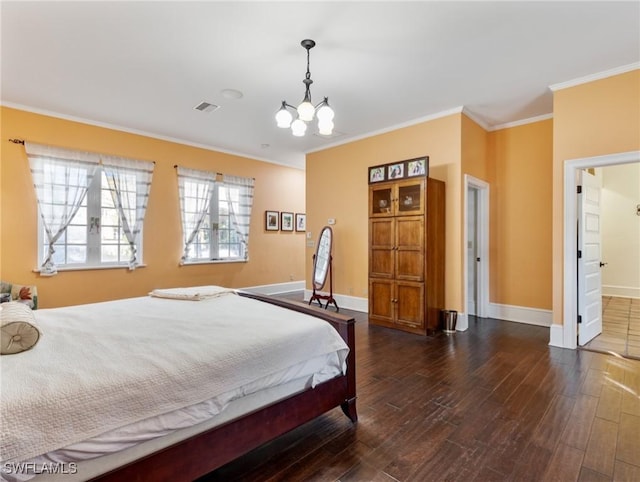 bedroom featuring visible vents, crown molding, dark wood-type flooring, baseboards, and a notable chandelier