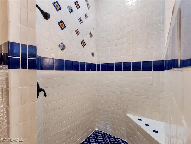 full bath with a tile shower