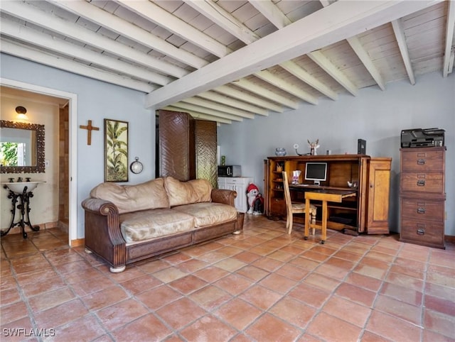 living room featuring light tile patterned floors and beamed ceiling