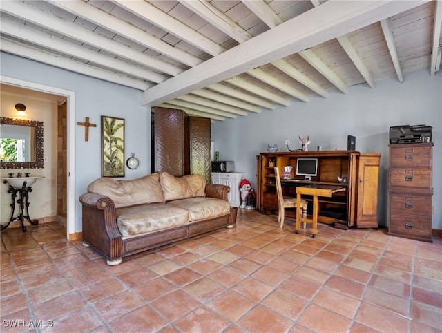 living area featuring light tile patterned floors and beamed ceiling