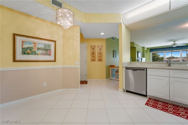 kitchen featuring baseboards, visible vents, a sink, light countertops, and stainless steel dishwasher