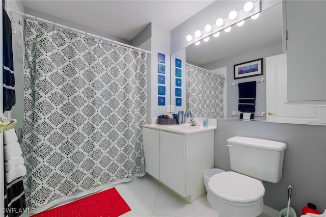 full bath featuring a shower with curtain, toilet, vanity, and tile patterned flooring