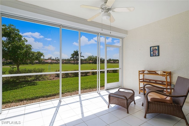 sunroom / solarium with ceiling fan