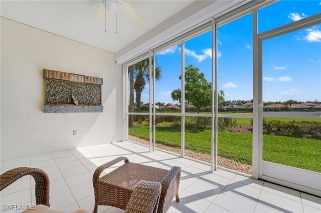 sunroom with a ceiling fan