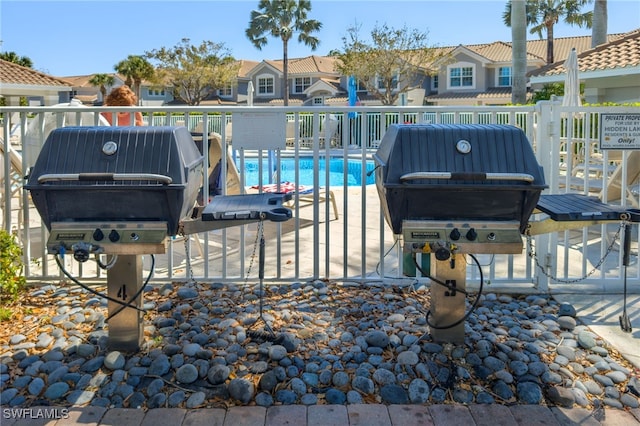 view of patio with a residential view and grilling area