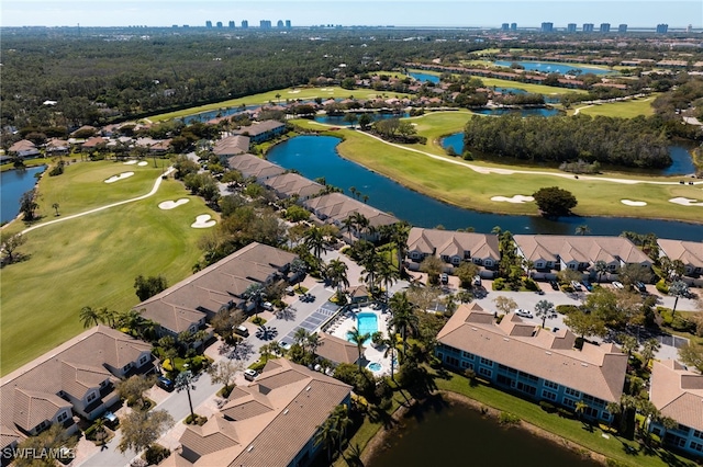 birds eye view of property with a residential view, a water view, and golf course view