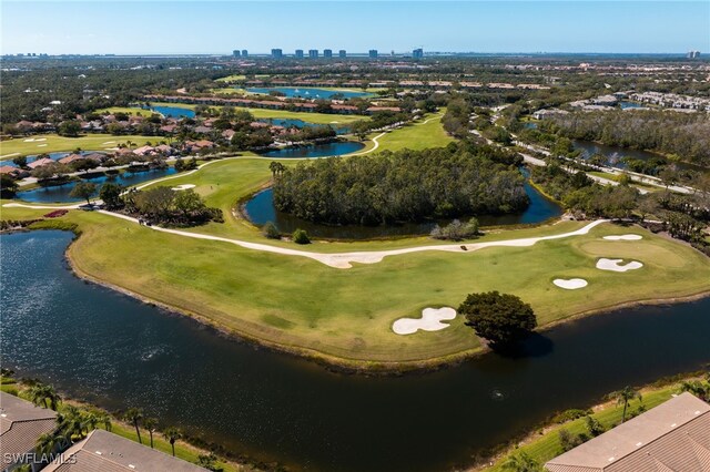 bird's eye view with a water view, view of golf course, and a view of city