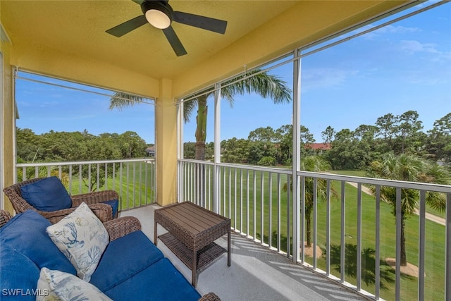 sunroom / solarium with a ceiling fan