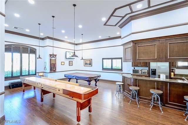 playroom with visible vents, ornamental molding, dark wood finished floors, recessed lighting, and baseboards