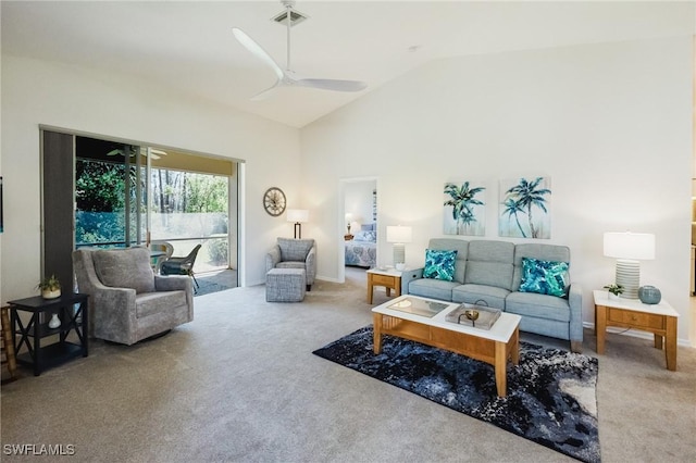 living area with visible vents, high vaulted ceiling, carpet flooring, and a ceiling fan