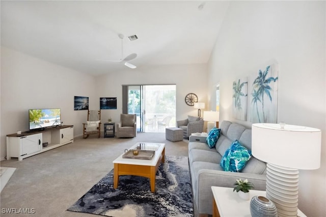 living area featuring visible vents, carpet flooring, a ceiling fan, and vaulted ceiling