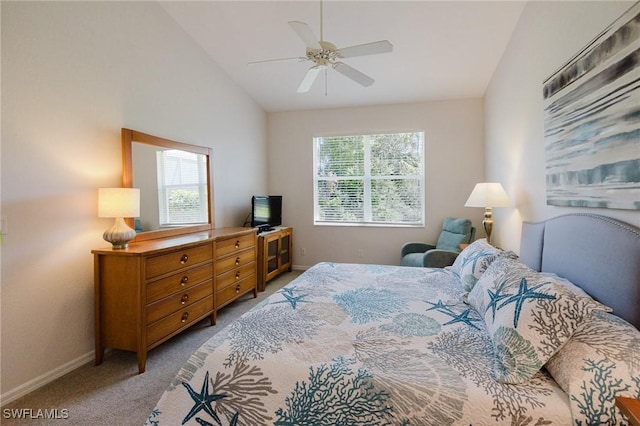 bedroom with multiple windows, baseboards, carpet, and vaulted ceiling