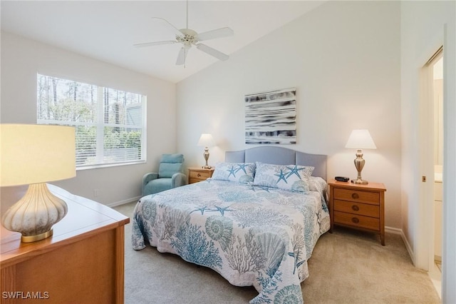 bedroom featuring vaulted ceiling, a ceiling fan, baseboards, and light carpet